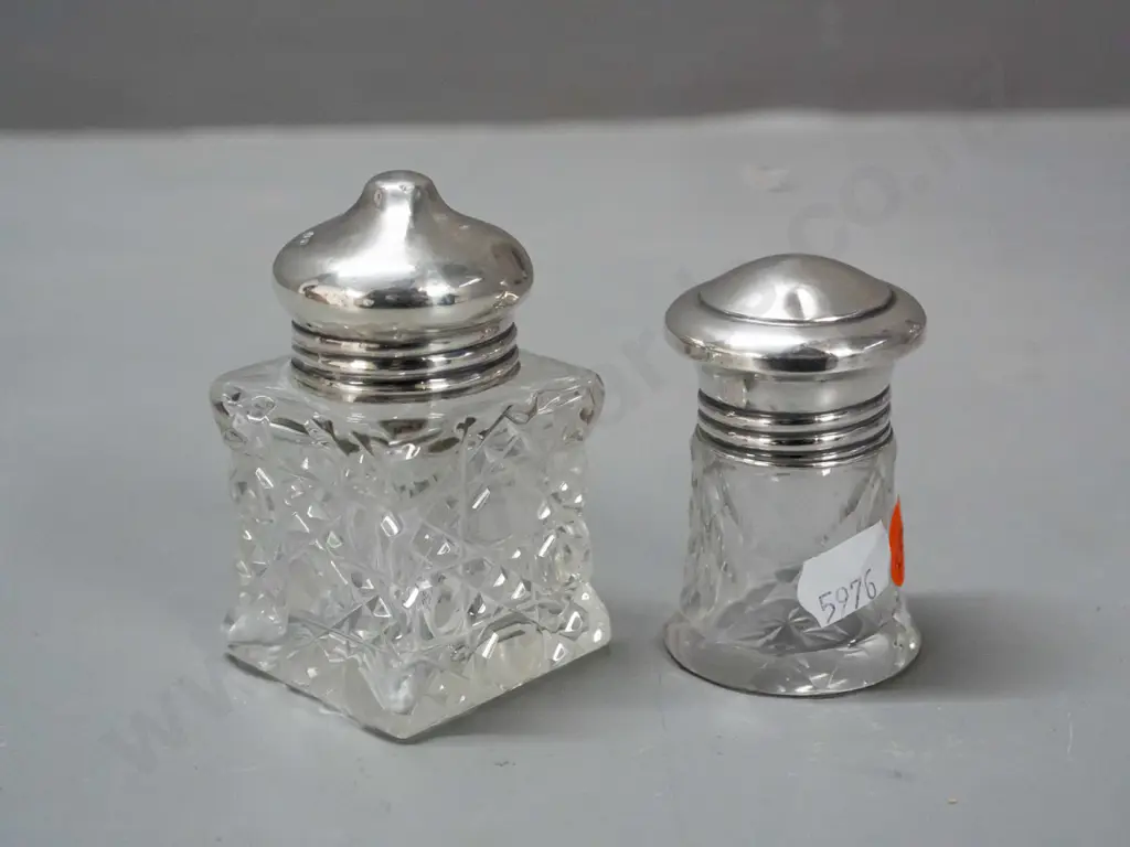 2 cut glass scent bottles with sterling silver tops - smaller one has glass stopper under cap, both caps have some dents Image 1++