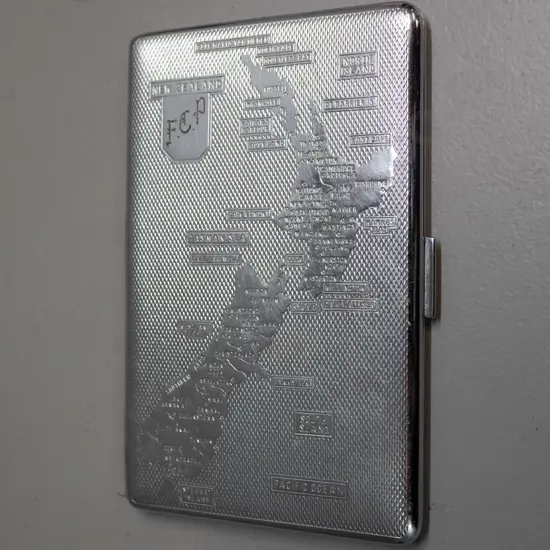 retro souvenir silver plated cigarette case with New Zealand map, marked Har-Bro England inside 130 x 85