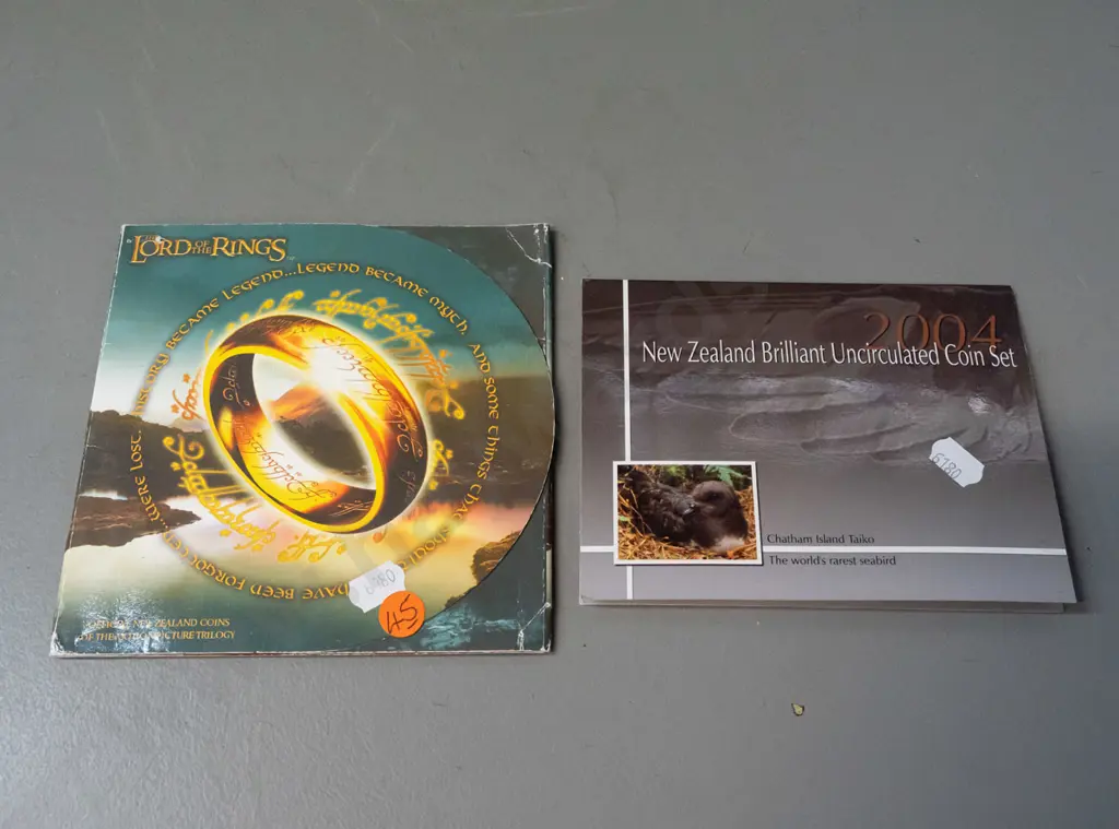 2 New Zealand uncirculated coins sets - 2003 Lord of the Rings set of 3 (minor wear to cardboard) and a 2004 set Image 1++