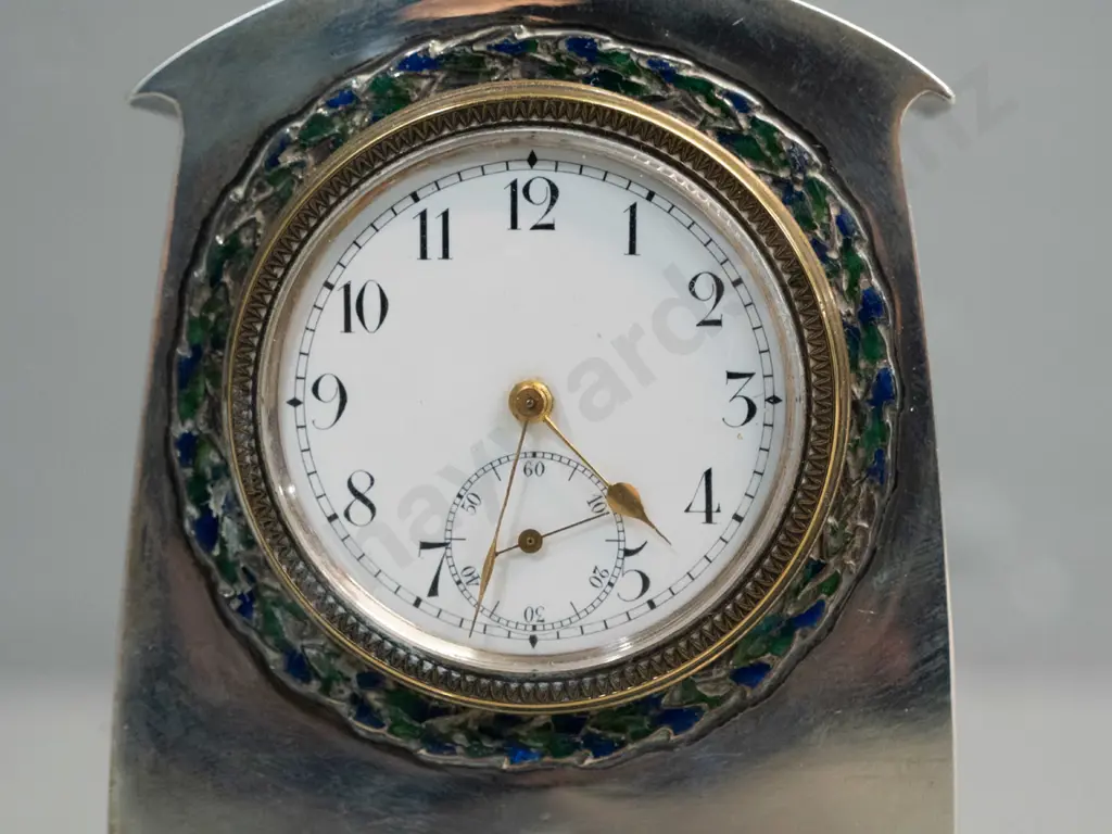 small mantel clock in sterling silver case, enamel band around bezel, brass bezel and porcelain face marked Swiss made Image 1++