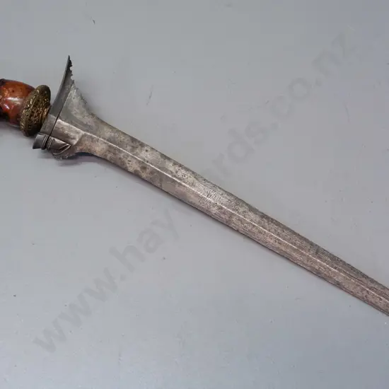 Indonesian Aceh kris with wooden handle, ornate circular brass hilt, intricately detailed shaping to hilt end of blade,
