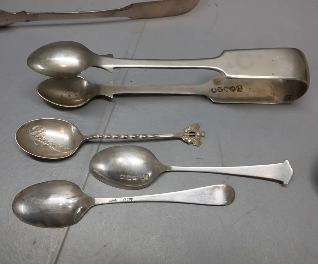 assorted silver and plated items - sterling silver napkin ring, sugar tongs, and 2 teaspoons, plated items and 2 1953 Image 1++