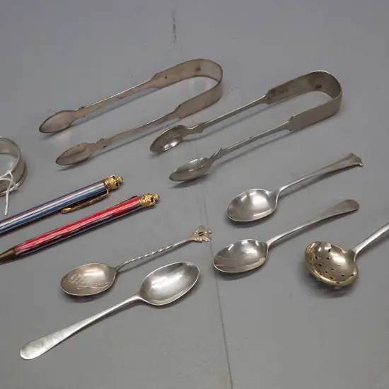 assorted silver and plated items - sterling silver napkin ring, sugar tongs, and 2 teaspoons, plated items and 2 1953