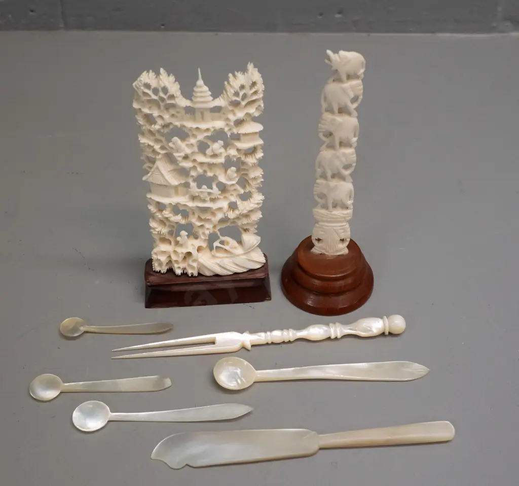 2 asian faux-ivory carved composite ornaments on wooden bases & 6 small mother of pearl condiment items. Tallest is H130 Image 1++