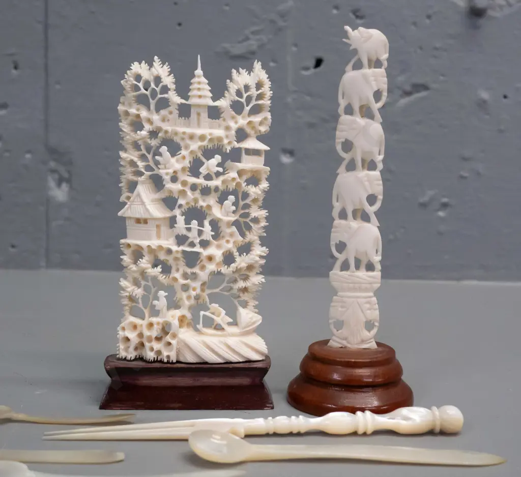 2 asian faux-ivory carved composite ornaments on wooden bases & 6 small mother of pearl condiment items. Tallest is H130 Image 1++