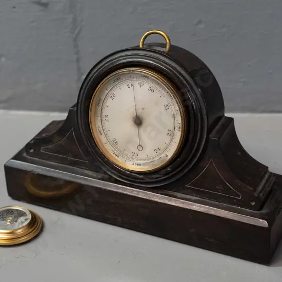 small brass cased pocket barometer with older timber pocket watch stand, has been modified to fit, some damage to
