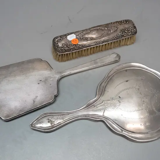 sterling silver backed dressing table ware, all hallmarked - 2 hand mirrors and a clothes brush. Some staining &