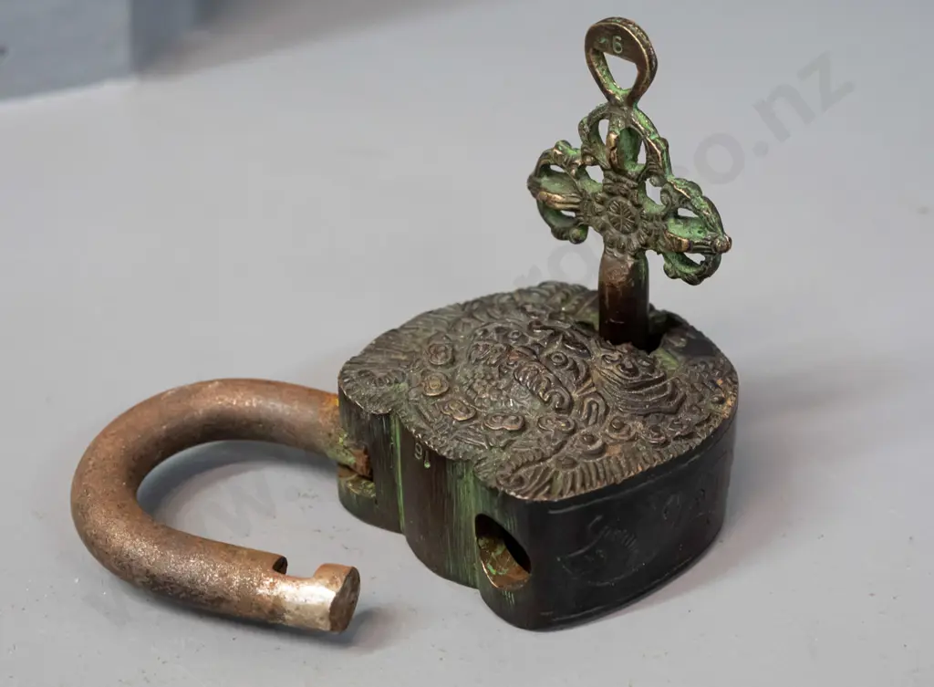ornate cast metal padlock with 2 keys - working - 2 smaller keys and a figural cast metal ladle or mould with figure on Image 1++