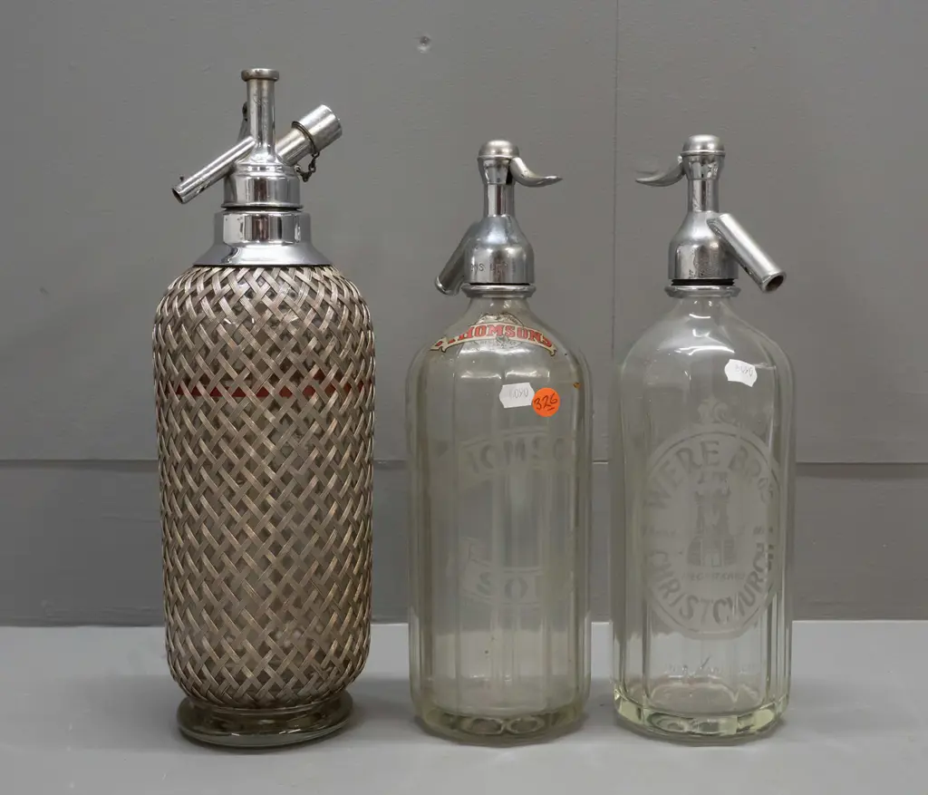 3 soda syphons - etched Were Bros Christchurch, etched Thomsons and an English with woven wire mesh covering H340. Some Image 1++