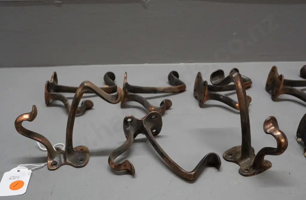 8 vintage cast metal copper finish double coat hooks - some wear and surface corrosion H-110 D-100 Image 1++