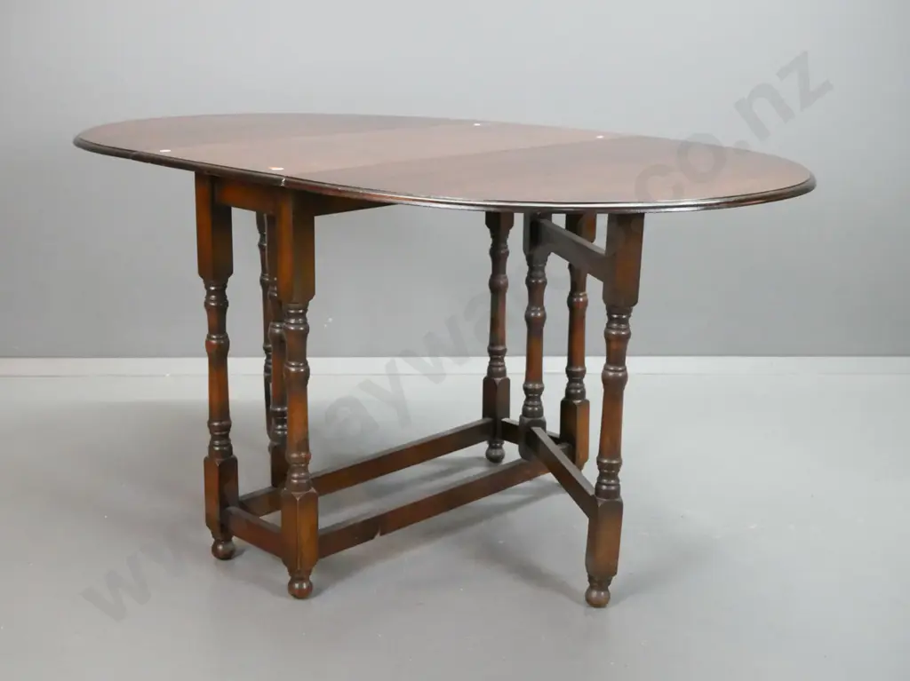 vintage oak oval gate-leg drop side table with turned legs and supports, square section stretcher base. Some stain marks Image 1++