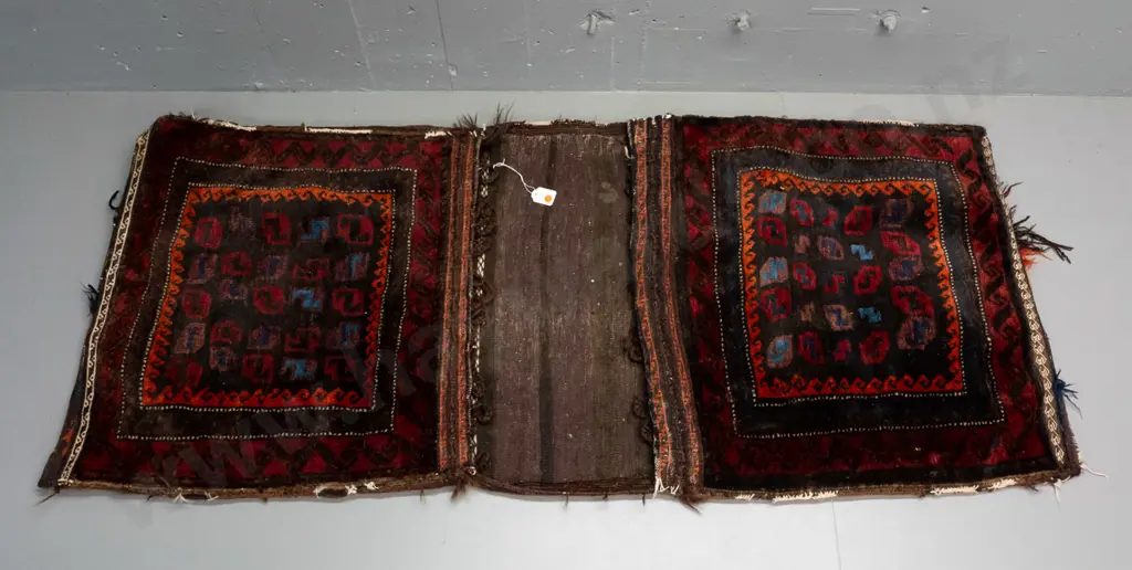 hand knotted wool Persian style saddle bag - geometric pattern dark red, blue, orange etc - most fringing is worn away, Image 1++
