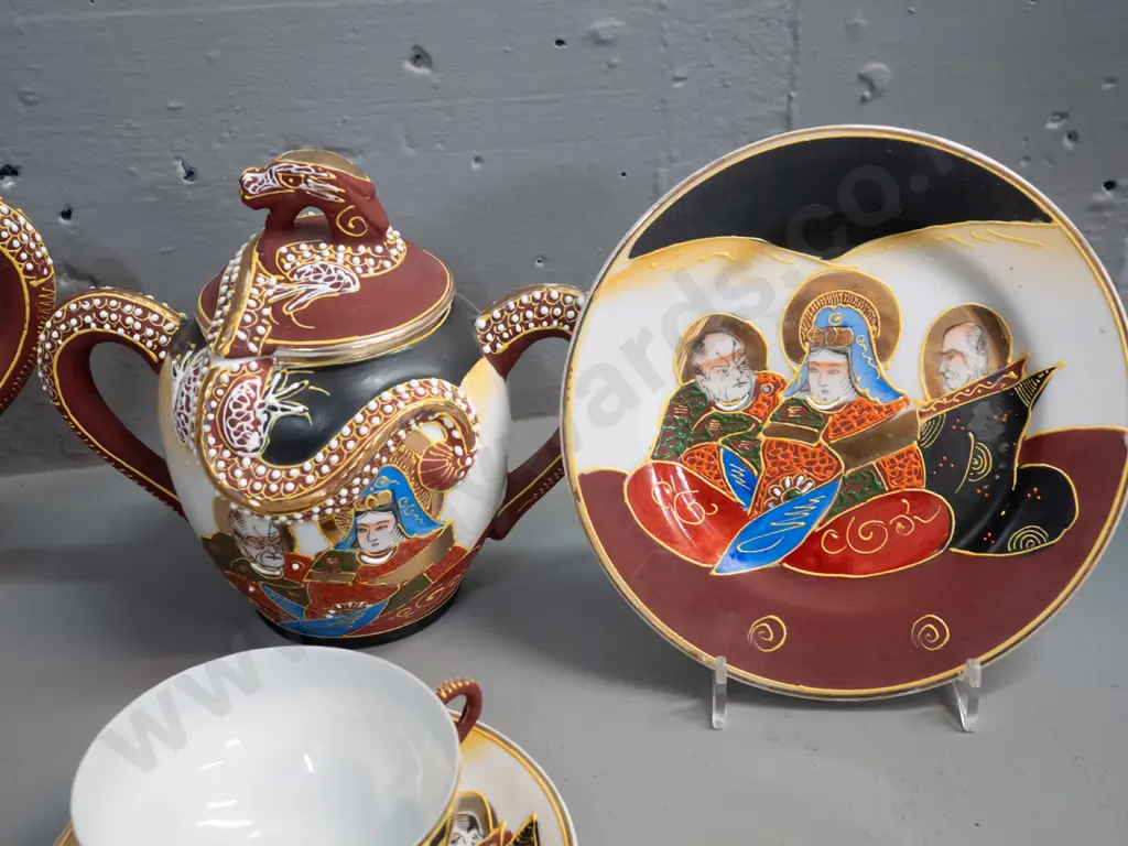 Japanese tea set with figural portrait and raised dragon motif decoration and lithophane geisha face in tea-cup base. Image 1++