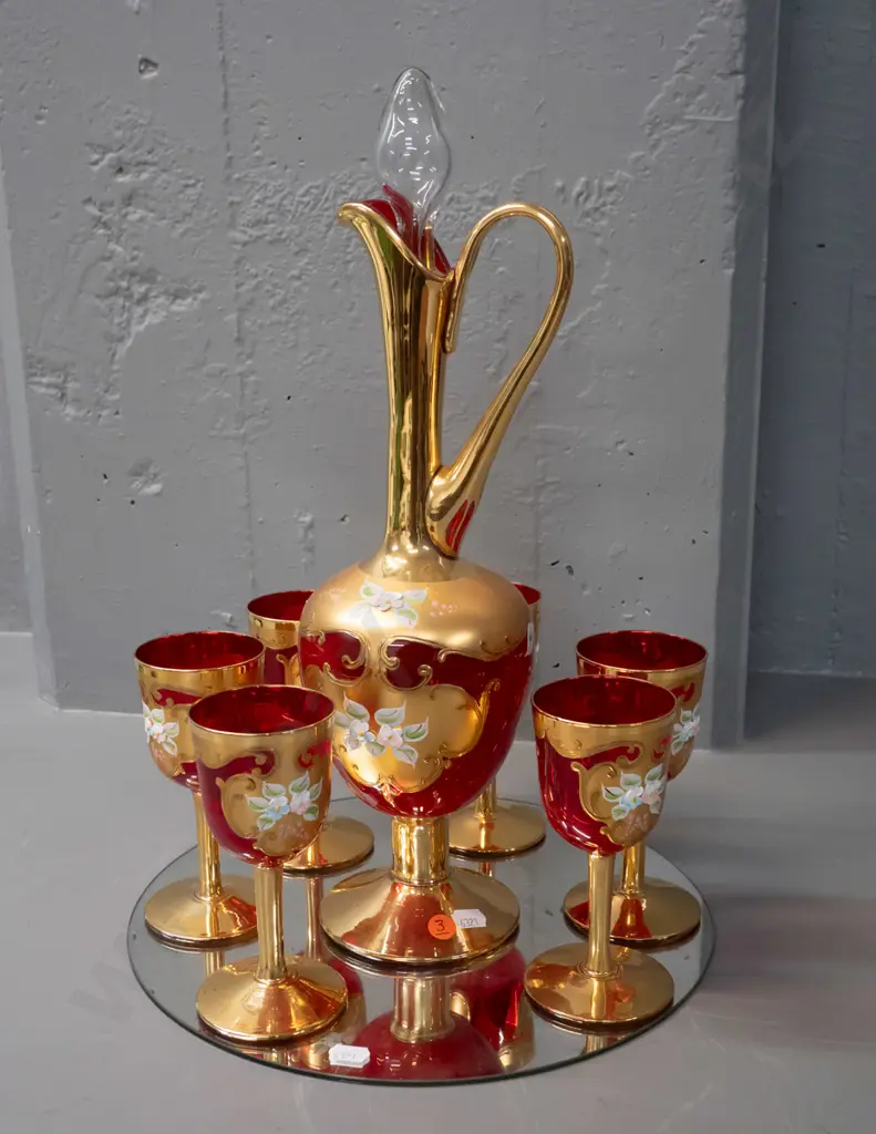 red Venetian glass stoppered handled decanter and 6 small goblets - Vetro Opalina Italy label - on round display mirror. Image 1++
