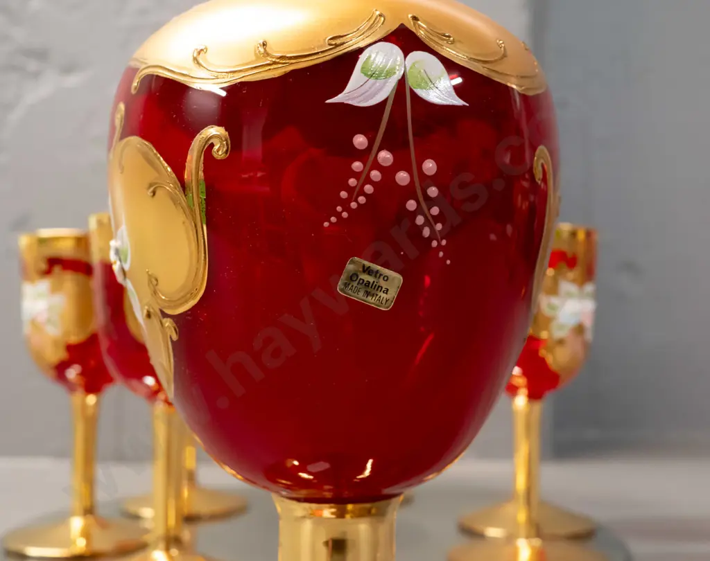 red Venetian glass stoppered handled decanter and 6 small goblets - Vetro Opalina Italy label - on round display mirror. Image 1++