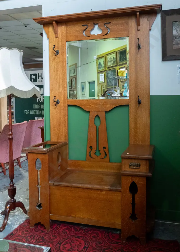arts & crafts style oak hall stand with bevelled edge mirror, metal coat hooks, pierced decoration, umbrella stand with Image 1++