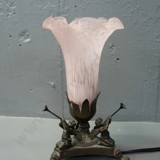 cast metal 3-footed lamp with trumpet-playing cherubs, mottled pink frilled glass shade H-210 - slight bending in places