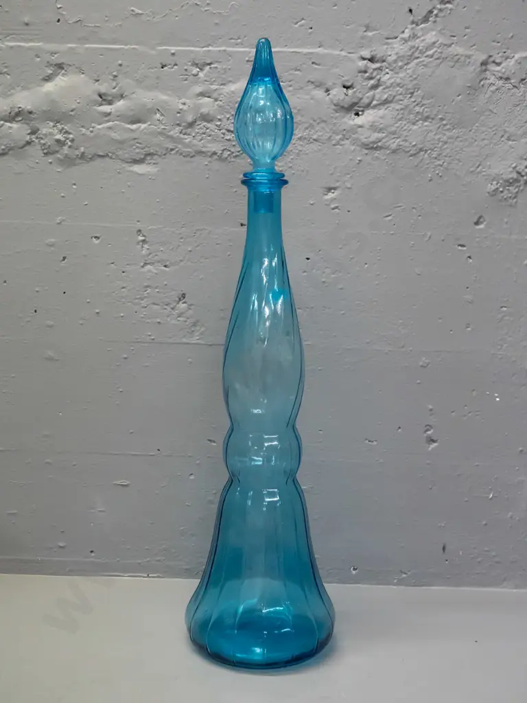 large turquoise glass genie bottle with stopper - missing plastic seal for stopper. H-640 D-170 at widest Image 1++