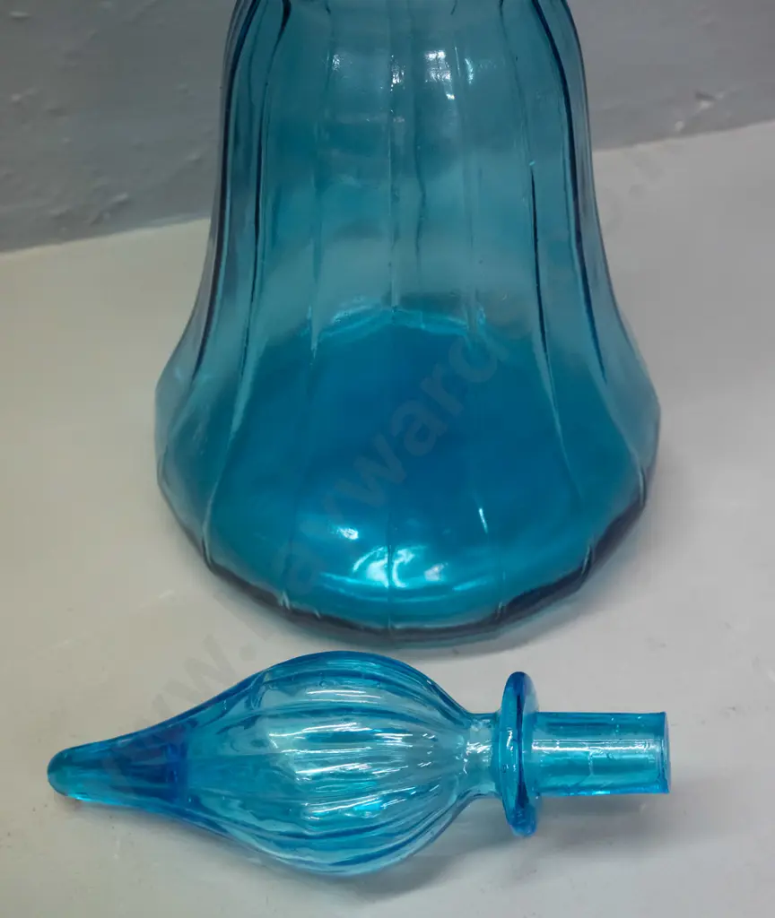 large turquoise glass genie bottle with stopper - missing plastic seal for stopper. H-640 D-170 at widest Image 1++