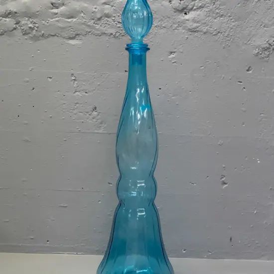 large turquoise glass genie bottle with stopper - missing plastic seal for stopper. H-640 D-170 at widest