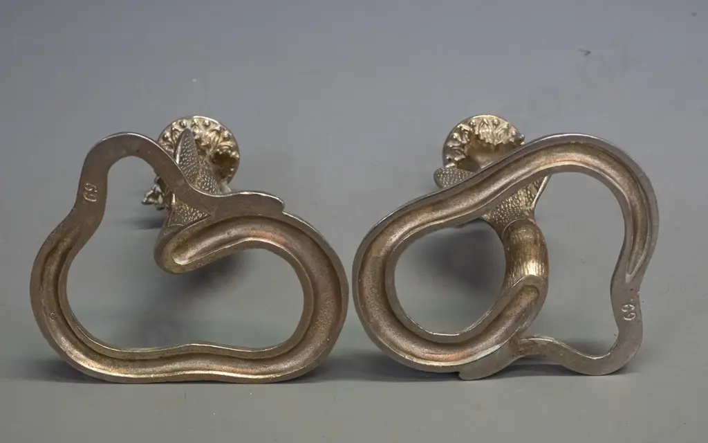 pair of cast metal cobra candlesticks H-170 W-120 Image 1++