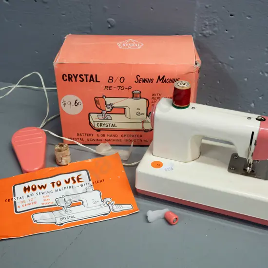 vintage "Crystal" toy sewing machine with original box, cotton spool, booklet, etc. - H-140 L-170