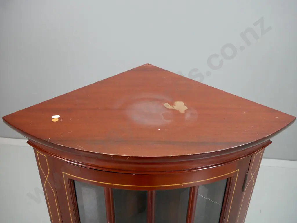 reproduction mahogany corner cupboard with bow-front astragal glazed door with bevelled edge panels, on shaped bracket Image 1++