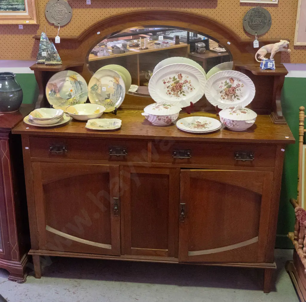 art nouveau sideboard with oval bevelled edge mirror in top, 2 small shelves, 2 drawers over 2 cupboard doors, foliate Image 1++