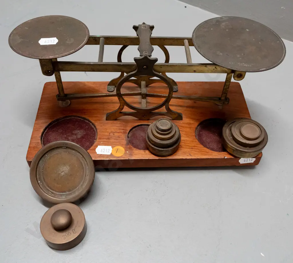 vintage brass balance scales on timber base with weights in fitted holes, one plate marked Waterlow & Sons London, plus Image 1++