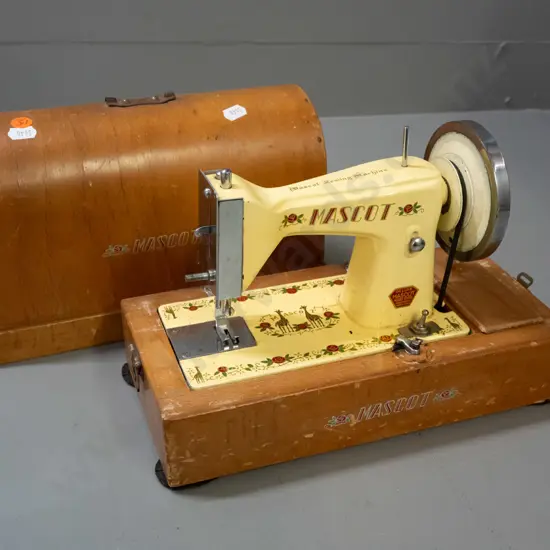 vintage child sized Mascot battery powered sewing machine with wooden dome case - made in Japan - has corrosion and