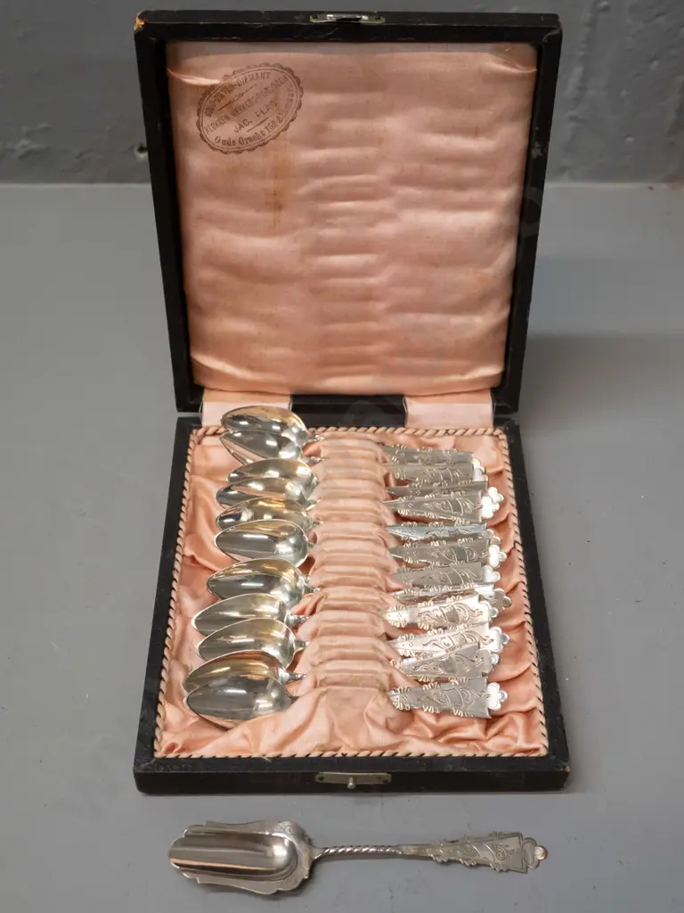 cased set of 12 teaspoons and a sugar scoop - continental sterling silver? Unknown mark, Dutch stamp inside case Image 1++