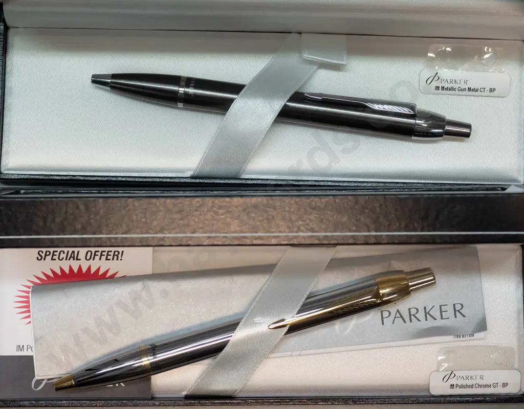 2 boxed Parker "IM" biro pens - one polished chrome and gold, the other Metallic gun metal Image 1++