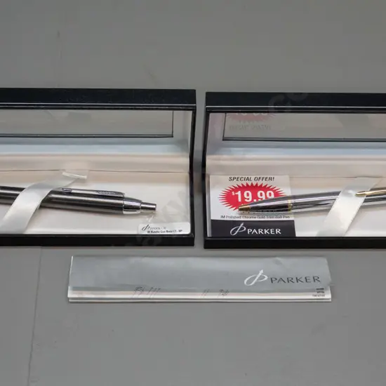 2 boxed Parker "IM" biro pens - one polished chrome and gold, the other Metallic gun metal