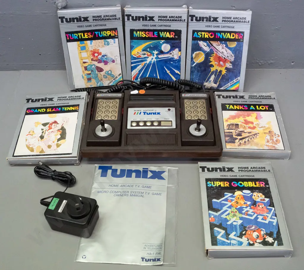 1980s Tunix Home Arcade video game console with 2 controllers, original manual, 6 game cartridges in original boxes - Image 1++