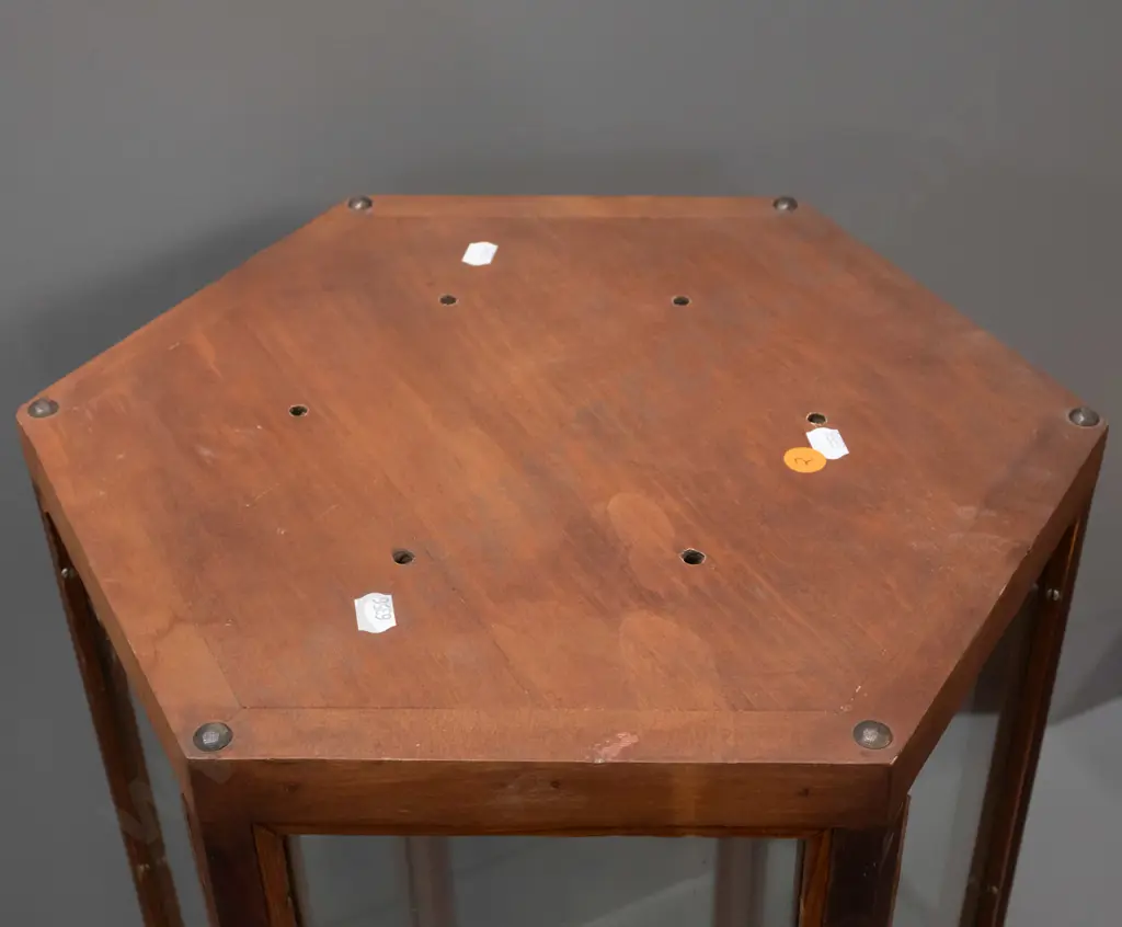 vintage hexagonal glazed timber display case on metal casters, one side has half panel and opening, 6 holes drilled in Image 1++