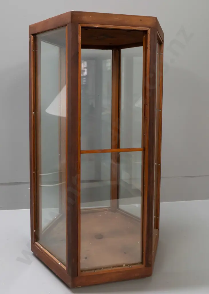 vintage hexagonal glazed timber display case on metal casters, one side has half panel and opening, 6 holes drilled in Image 1++