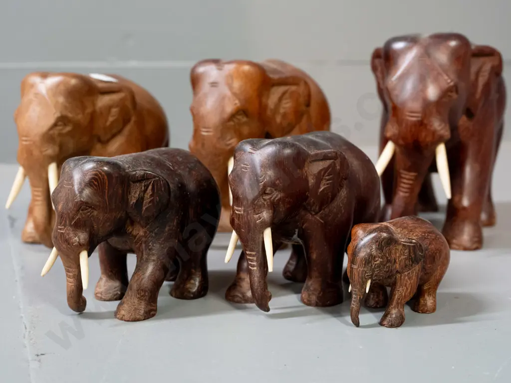 6 carved teak and other hardwood elephants. Largest is H-120 L-150 Image 1++