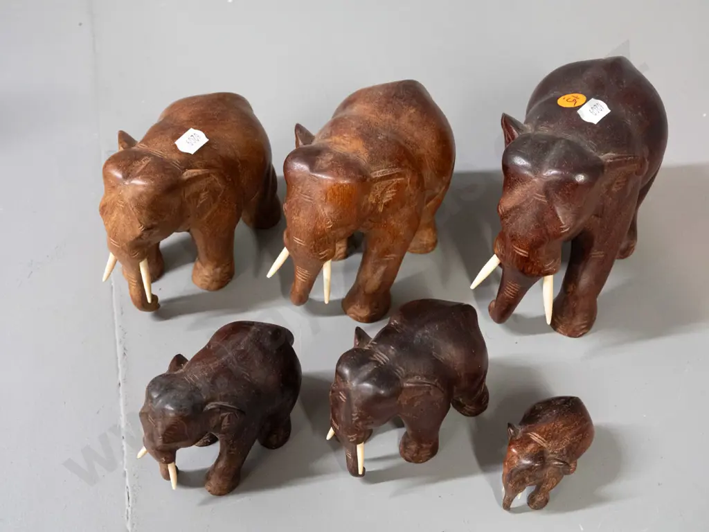 6 carved teak and other hardwood elephants. Largest is H-120 L-150 Image 1++