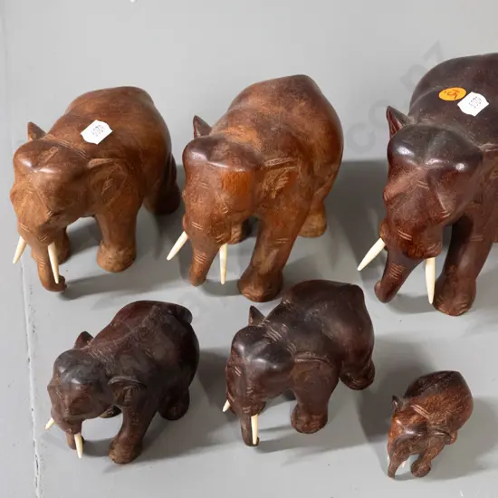 6 carved teak and other hardwood elephants. Largest is H-120 L-150