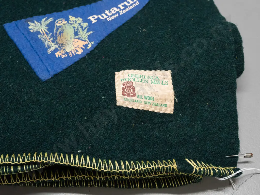 green woollen blanket with Onehunga label and numerous Boy Scouts and other badges, location pennants etc - some fading Image 1++
