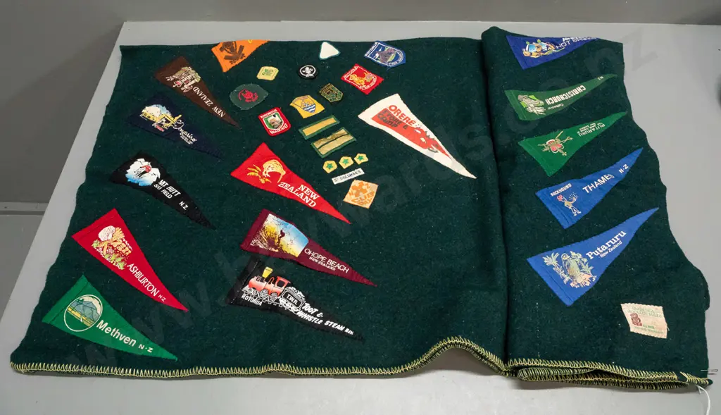 green woollen blanket with Onehunga label and numerous Boy Scouts and other badges, location pennants etc - some fading Image 1++