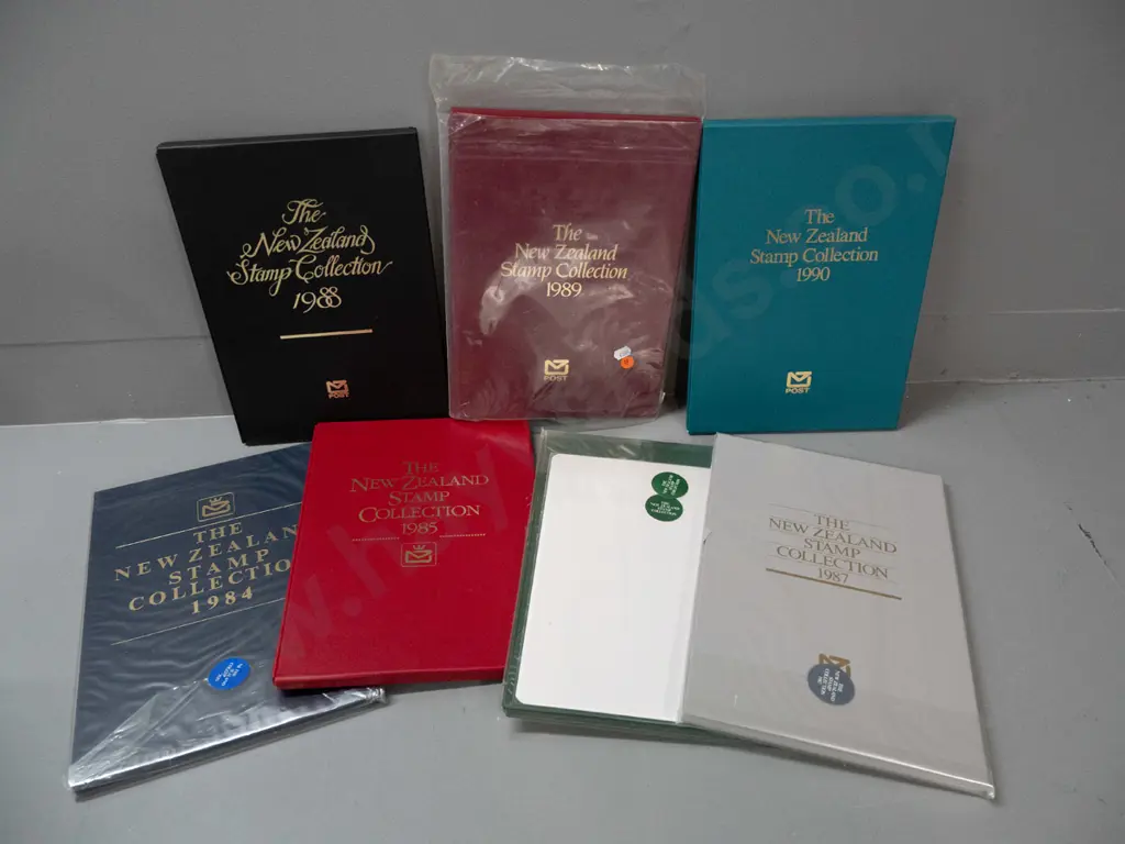 7 New Zealand annual stamp collector's albums - 1984 thru 1990, 3 still sealed Image 1++