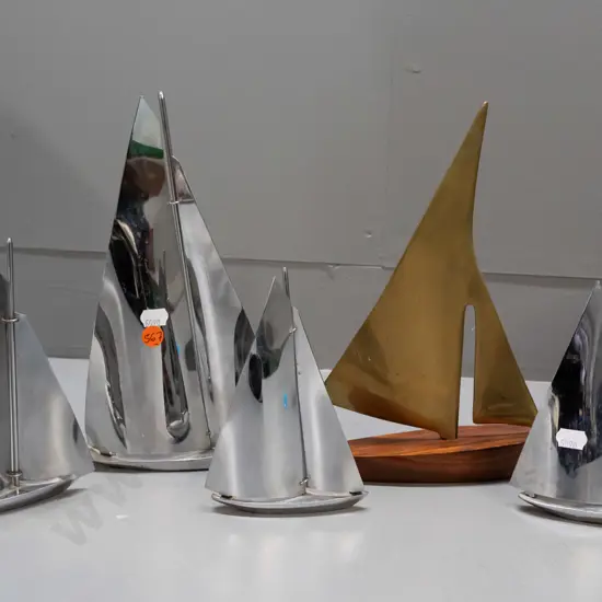 5 retro yacht models - 4 chrome & one teak with brass sails H-250 L-190. Minor pitting or corrosion to chrome.