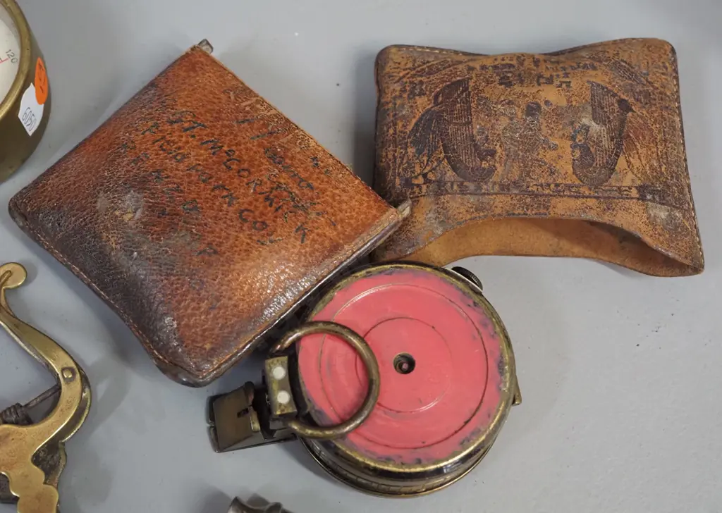 brass central door knob, brass compass faintly marked NZFS and Barker & Son (1932) tooled leather slip case, bosuns Image 1++