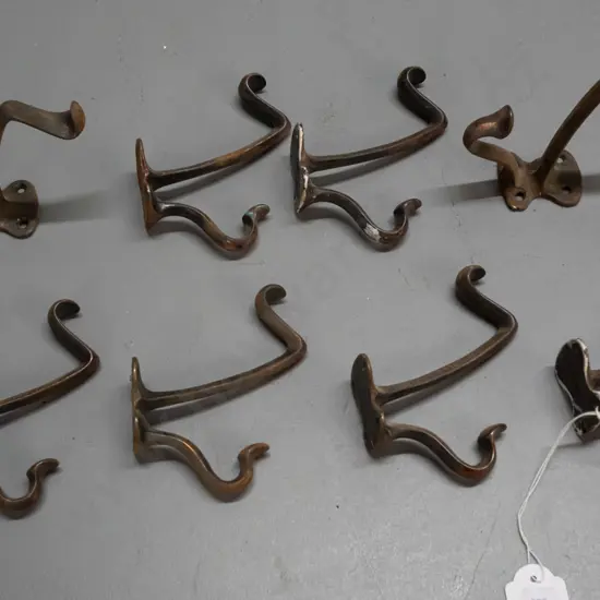 8 vintage cast metal copper finish double coat hooks - some wear and surface corrosion H-110 D-100