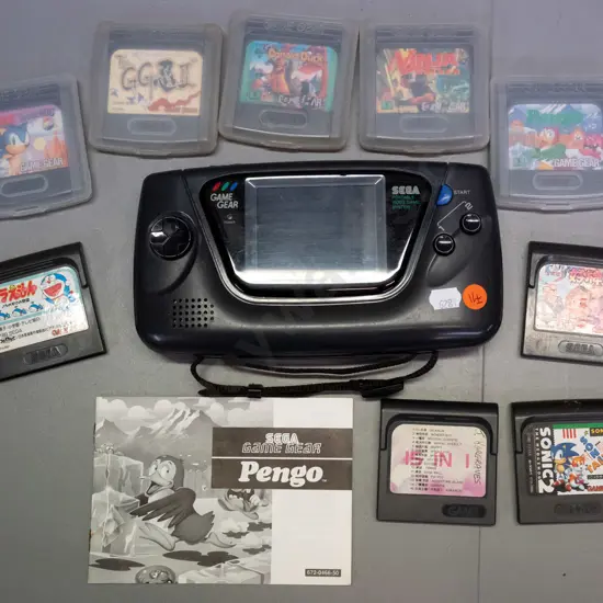 Sega Game Gear handheld game console with 9 games, 5 in plastic cases - untested