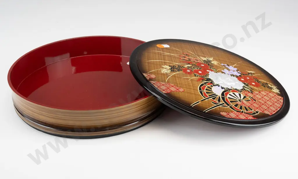 round lidded asian lacquer box with flower cart motif and relief flower - repaired chip to base Image 1++