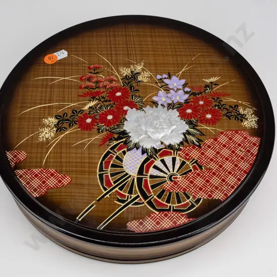 round lidded asian lacquer box with flower cart motif and relief flower - repaired chip to base