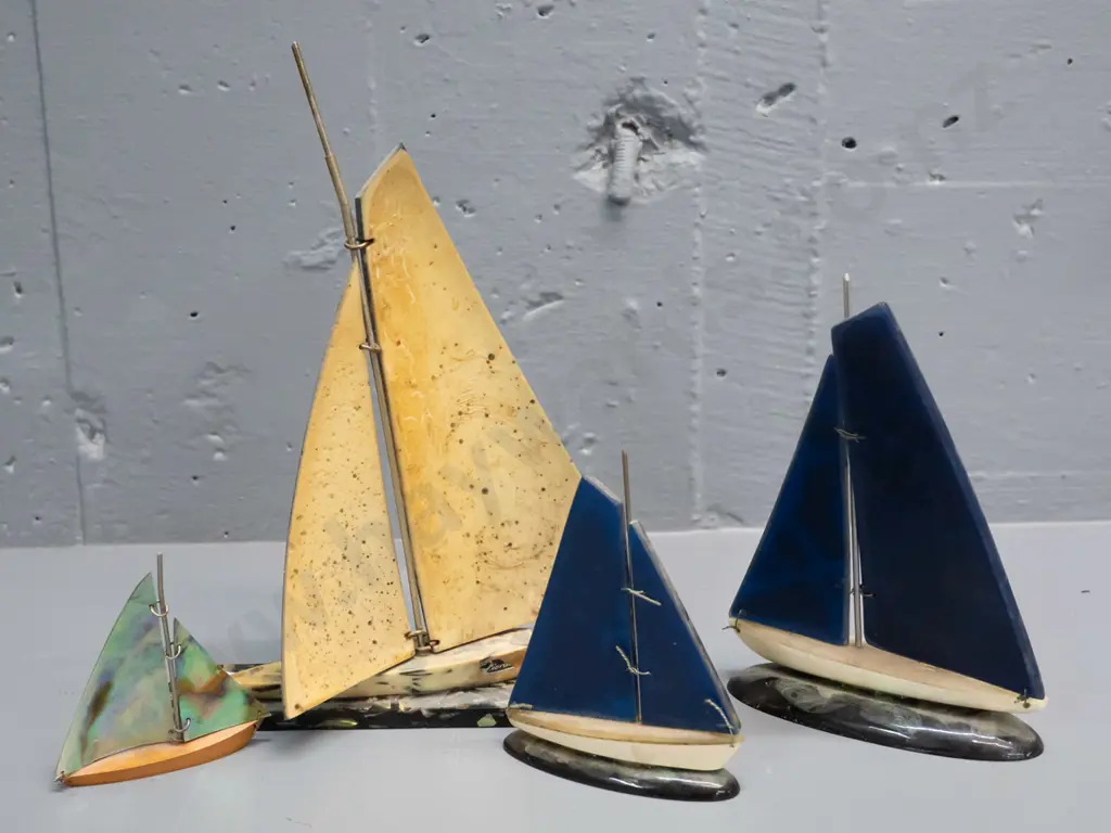 4 retro paua shell, acrylic & composite ornamental yachts, smallest has wooden base and a label. Large one has a slight Image 1++