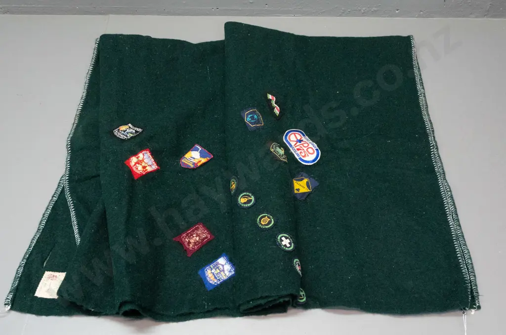 green woollen blanket with Onehunga label and numerous Girl Guides and other badges & NZ souvenir pennants - wear and a Image 1++